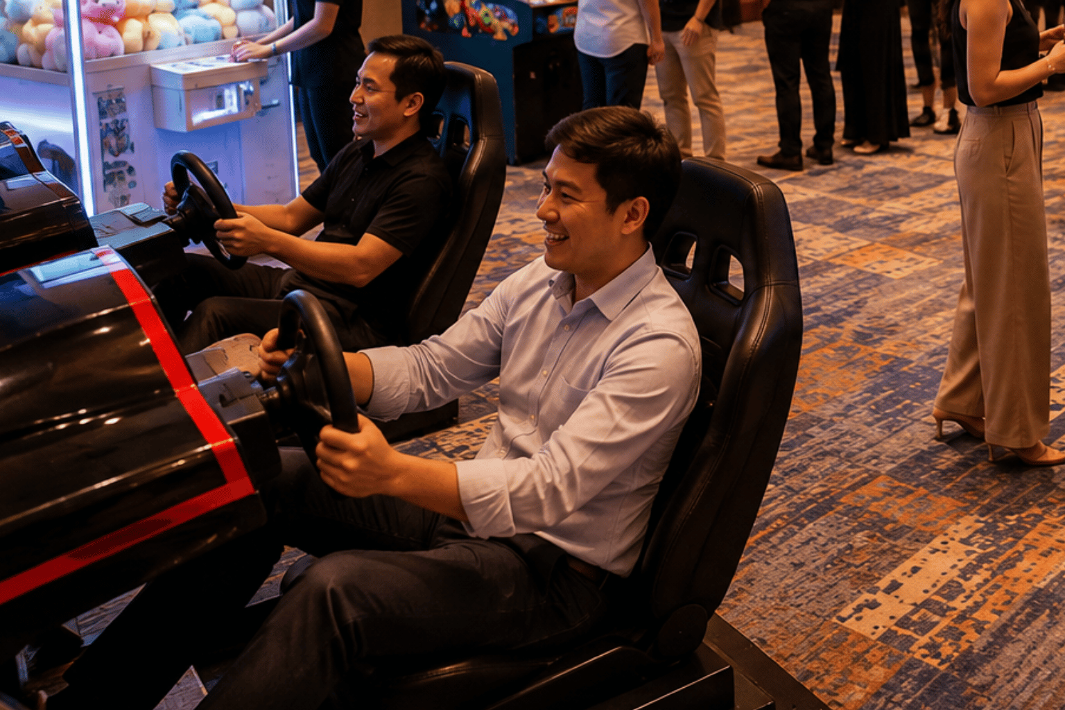 Arcade machine rental in Singapore allows two corporate event guests to compete on racing simulators while other attendees watch nearby